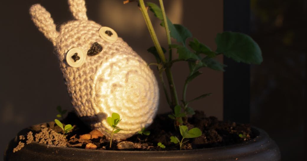 cute knit toy in plant pot